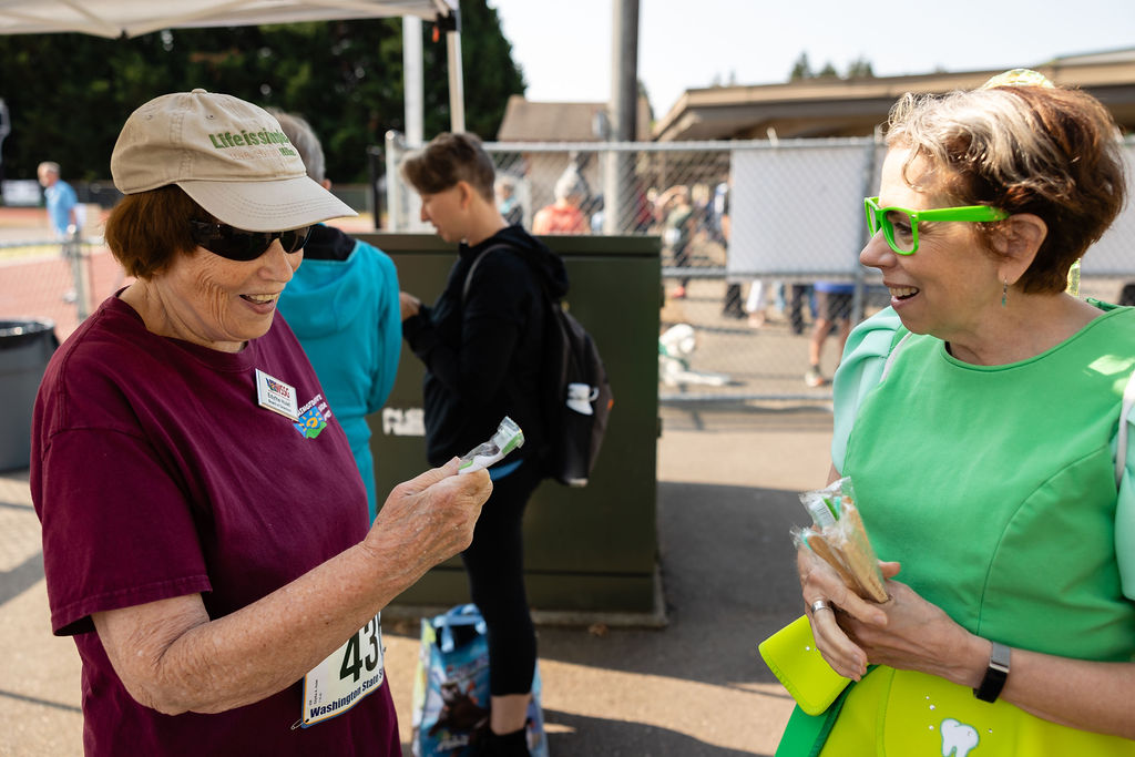 Track and field photos featuring Delta Dental's Tooth Fairy'